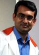 Dr. Kaushik B