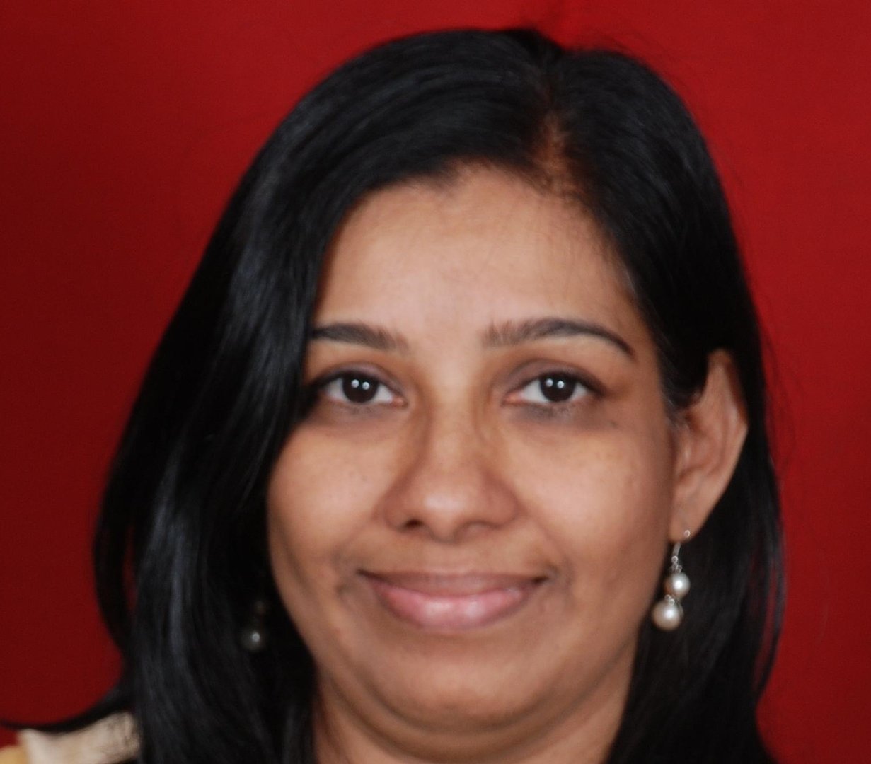 Dr. Asha Menon